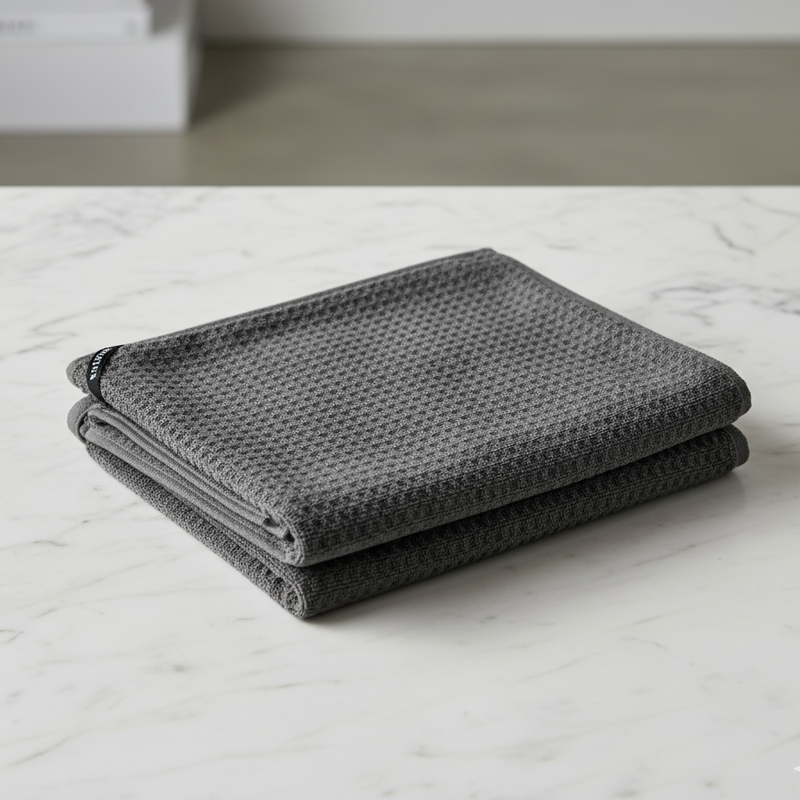 Grey textured towel on a marble surface