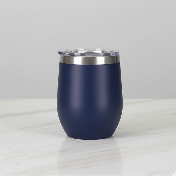 Navy blue tumbler with silver lid on a light grey background
