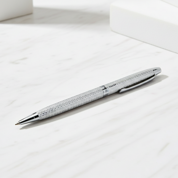 Silver pen on a white surface