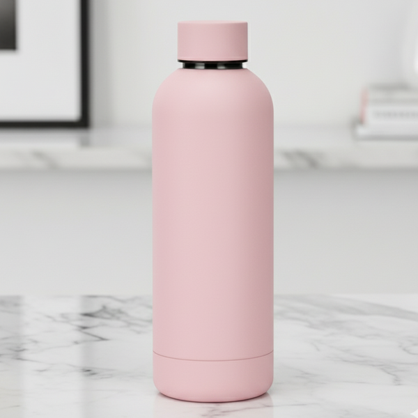 Pink water bottle on a marble surface. Gifts Two Streets Over