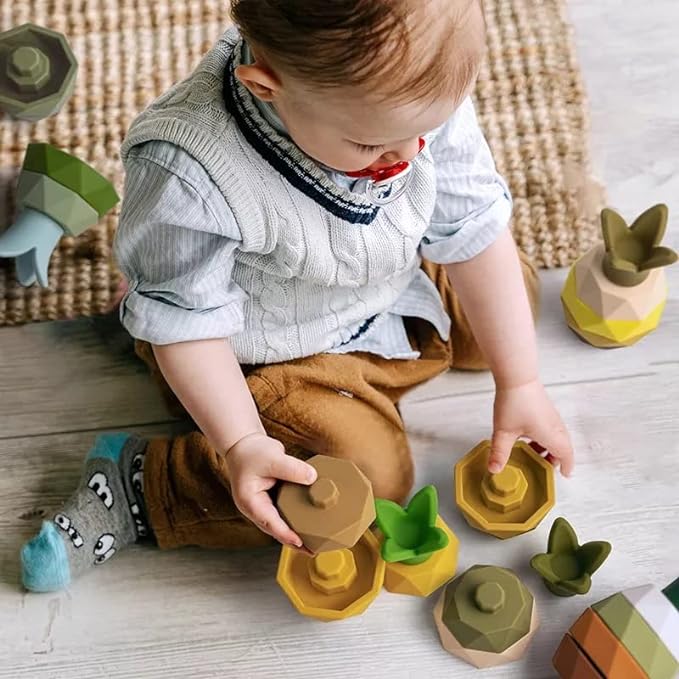 kid playing with silicone stack toy
